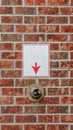 Vertical Brick wall with arrow pointing to fire sprinkler