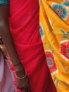 Vertical of bright-colored saris on tribal women in a weekly market in Ankadeli, Orissa in India Royalty Free Stock Photo