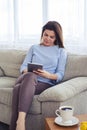 Vertical of brunette working in laptop