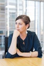 Vertical business woman in city office with buildings in background Royalty Free Stock Photo