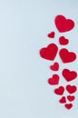 Vertical card Valentine`s Day. Red hearts on a gray-blue background Royalty Free Stock Photo