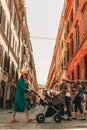 Vertical cityscape with People walking around Rome's alleys and streets