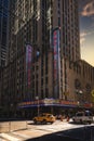 Vertical cityscape of The Radio City Music Hall theatre venue on West 50th Street in New York at sunset