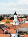 Vertical cityscape view with red-tiled buildings and the Castle of Eger in Hungary