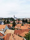 Vertical cityscape view with traditional red-tiled buildings in Eger, Hungary