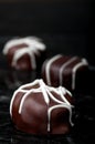 Vertical close up of chocolate truffles