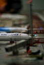 Vertical close-up of a commercial passenger jet on an airport runway