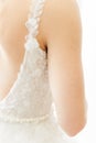 Vertical close-up of delicate lace straps on a bridal gown