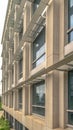 Vertical Close up of the glass windows and concrete exterior wall of a modern building Royalty Free Stock Photo