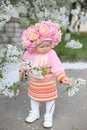 Vertical close-up photo of a little girl with a twig in his hands Royalty Free Stock Photo