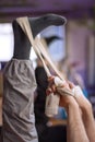 Vertical Close up of the risen leg of practitioners in a yoga class doing Supta Padangusthasana. Royalty Free Stock Photo