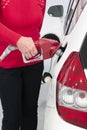 Woman Fueling Her Car