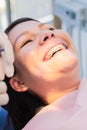 Vertical close-up shot of a young patient receiving care for her braces. Royalty Free Stock Photo