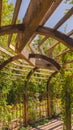 Vertical Close up of the wooden arbor at a wedding venue under blue sky on a sunny day Royalty Free Stock Photo