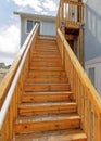 Vertical Close up of wooden stairway with handrails at home exterior against cloudy sky Royalty Free Stock Photo