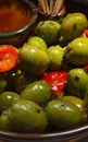 Vertical closeup of aceitunas, green olives shining from having an oily surface