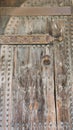 Vertical closeup of an ancient wooden door in the Los Serrano tower in Valencia, Spain