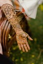 Vertical closeup of a beautiful Bridal henna, mehndi on the hand of an Indian bride Royalty Free Stock Photo