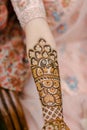 Vertical closeup of a beautiful Bridal henna, mehndi on the hand of an Indian bride Royalty Free Stock Photo