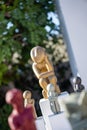 Vertical closeup of colorful statuettes Oia Santorini by local artists with blurred background
