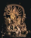 Vertical closeup of the Durga goddess statue against the dark background