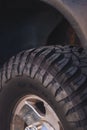 Vertical closeup of a General Grabber Mud Terrain tires on chrome wheels