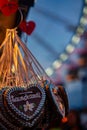 Vertical closeup of gingerbread Oktoberfest hearts displayed for sale at Munich