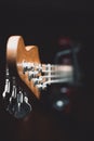 Vertical closeup of the head of the guitar with tuning keys. Royalty Free Stock Photo