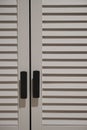 Vertical closeup of a louvered white window Royalty Free Stock Photo