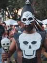 Vertical closeup of a man's face with a mask during the Day of the Dead celebration in Florida Royalty Free Stock Photo