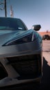 Vertical closeup of a modern gray sports car headlights Royalty Free Stock Photo