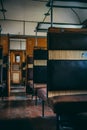 Vertical closeup of a narrow corridor between wooden seats in an old vintage transport Royalty Free Stock Photo