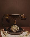 Vertical closeup of an old telephone in dim lighting in a luxury hotel in Bangkok, Thailand