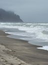 Vertical closeup of Oregon coast on the foggy day water with long exposure effect Royalty Free Stock Photo