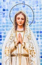 Vertical closeup of Our Lady of Fatima artwork