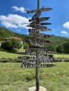 Vertical closeup of a post showing directions in green mountains of Serbia Royalty Free Stock Photo