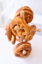 Vertical closeup of pretzels on a small wooden stand. Oktoberfest, Germany.