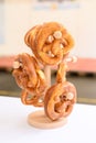 Vertical closeup of pretzels on a small wooden stand. Oktoberfest, Germany.