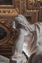 Vertical closeup of a sculpture of a sleeping god in a catholic church in Venice, Italy