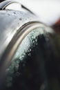 Vertical closeup selective focus shot a car window glass with water drops on top Royalty Free Stock Photo