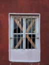 Vertical closeup shot of an abandoned building window Royalty Free Stock Photo