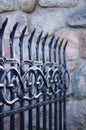Vertical closeup shot of the beautiful patterned details of an iron fence Royalty Free Stock Photo