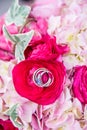 Vertical closeup shot of a bridal flower bouquet with rings in the center Royalty Free Stock Photo