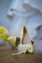 Vertical closeup shot of bridal yellow heels