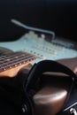 Vertical closeup shot of a brown white electric guitar Royalty Free Stock Photo