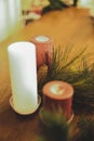 Vertical closeup shot of Christmas candles spreading a festive cheerful atmosphere