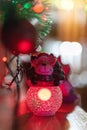 Vertical closeup shot of a Christmas ornament under red light Royalty Free Stock Photo