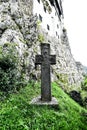 Vertical closeup shot of a cross outside of Bran Castle, Romania