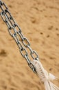 Vertical closeup shot of a double metal chain with a blurred background