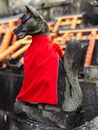 Vertical closeup shot of a fox statue in the Fushimi Inari Shrine Japan Royalty Free Stock Photo